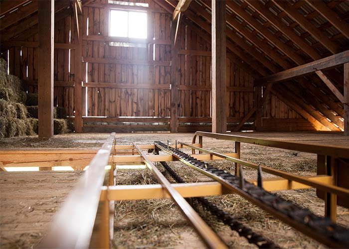 Interior of a hayloft of a barn with a hay elevator