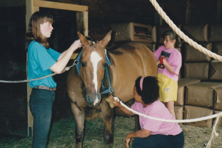 Elizabeth Hamshaw helping out at her mom Marianne Hamshaw's summer camp